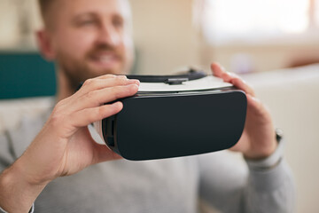 Man with VR goggles at home