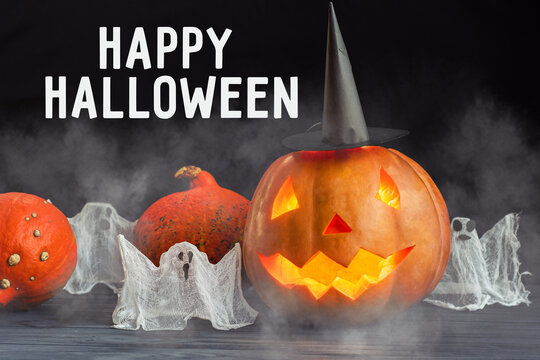 halloween Jack o Lantern pumpkin squash in witch hat, candy bowl of cookies, candy, chocolates and sweets Treat card orange background