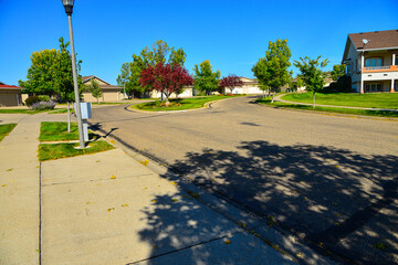 Modern homes line the streets of this comfortable clean neighborhood in growing Bismarck, North...