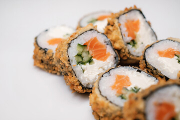Sushi roll with salmon. Traditional Japanese cuisine close-up.