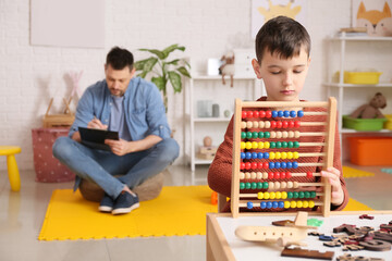 Little boy with autism spectrum disorder at psychologist's office