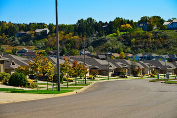 Modern homes line the streets of this comfortable clean neighborhood in growing Bismarck, North...