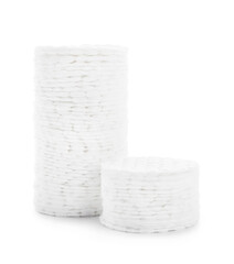 Stacks of clean cotton pads isolated on white background