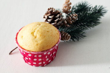 Christmas treat. Delicious sweet muffin. pine branch
