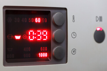 Electronic panel of the washing machine. 60 degrees Celsius. Close up. - obrazy, fototapety, plakaty