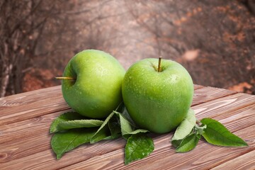 Fresh ripe sweet apples on the desk