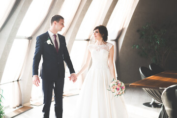 Naklejka premium Luxury married wedding couple, bride and groom posing in old city