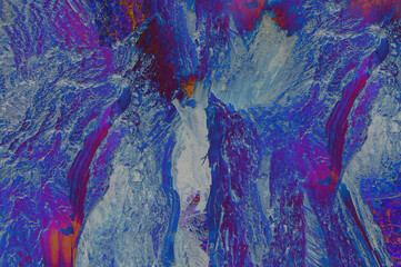 Abstract background with blue and bard streaks similar to a volcanic eruption