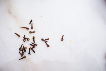 Cloves on marble background ingredients spices aromatic condiment organic fragrant and dry