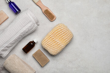 Bath supplies with sponge on light background