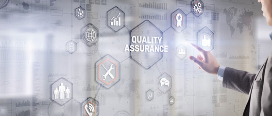 QA Businessman pressing Quality assurance button on virtual screens
