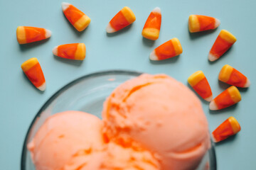 Candy Corns styled on a Blue Background with Orange Ice Cream