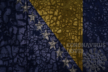 flag of bosnia and herzegovina on a old metal rusty cracked wall with text coronavirus, covid, and virus picture.