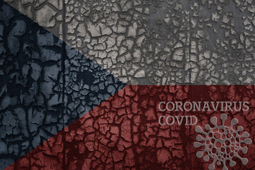 flag of czech republic on a old metal rusty cracked wall with text coronavirus, covid, and virus picture.