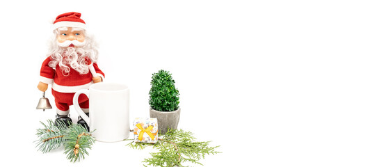 Christmas holiday background framed border banner styled with Santa Claus with empty white cane, fir branches and trees ornaments against a white backdrop with copy space