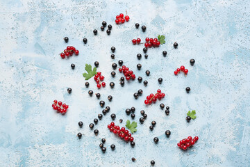 Tasty different currants on color background