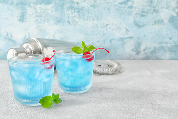 Glasses of Blue Lagoon cocktail on table