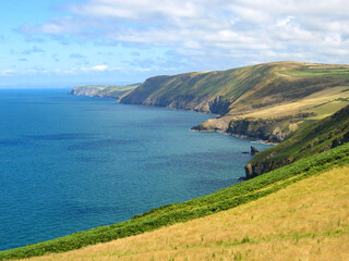 Scenic landscape view of fields and cliffs on the Welsh coastline. No people. Copy space.