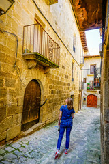 woman enjoying a walk through the town of Sos del Rey Catolico