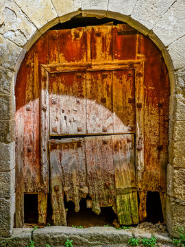 Old deteriorated wooden door in a neighborhood of Sos del Rey Catolico