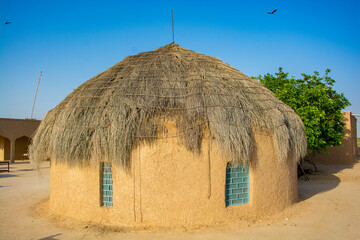 Thatched roof mud hut house in the Thar desert