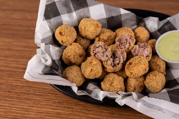 Portion of meat dumplings with special sauce