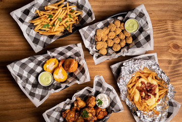 Finger Food Servings - Buffalo Wings, French Fries and Meat Dumpling