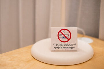 No smoking sign in hotel room. Non-smoking policy. Cigarettes and e-cigarettes forbidden.
