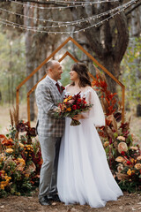 man and woman got engaged in autumn forest