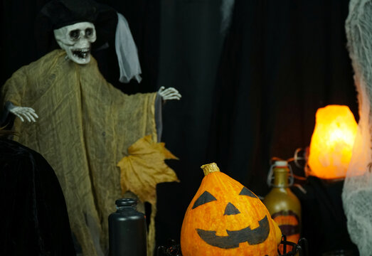 still life on Halloween. scenery. Skeleton, pumpkin, bottles