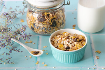 Dry muesli in a blue ceramic bowl