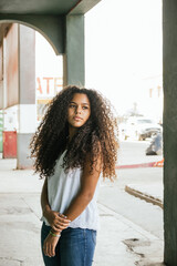 Portrait of a teenage cuban girl looking to the camera, closeup latin cuban teenage woman