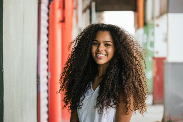 Portrait of a teenage cuban girl looking to the camera, closeup latin cuban teenage woman