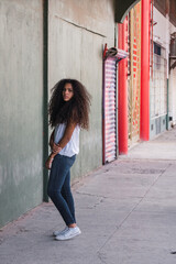 Portrait of a teenage cuban girl looking to the camera, closeup latin cuban teenage woman