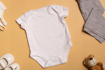 Mockup for design and placement of logos, advertising. White baby bodysuit, top view, mock up on...