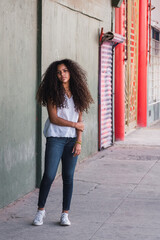 Portrait of a teenage cuban girl looking to the camera, closeup latin cuban teenage woman