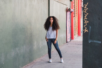 Portrait of a teenage cuban girl looking to the camera, closeup latin cuban teenage woman