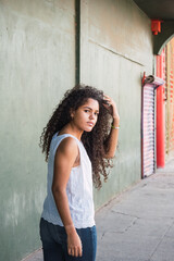 Portrait of a teenage cuban girl looking to the camera, closeup latin cuban teenage woman
