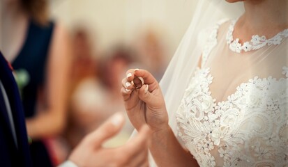 A bride and groom exchanging of the Wedding Rings during wedding ceremony