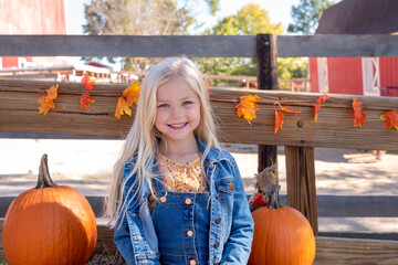 Cute little girl at the pumpkin farm - 465133008
