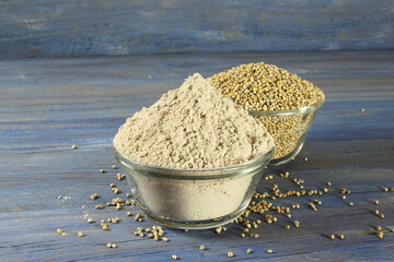 pearl millet grain whole and flour in bowl for indian gujarati food recipe as food background