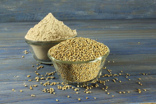 pearl millet grain whole and flour in bowl for indian gujarati food recipe as food background