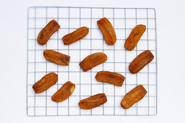 Sun dried bananas on white background.