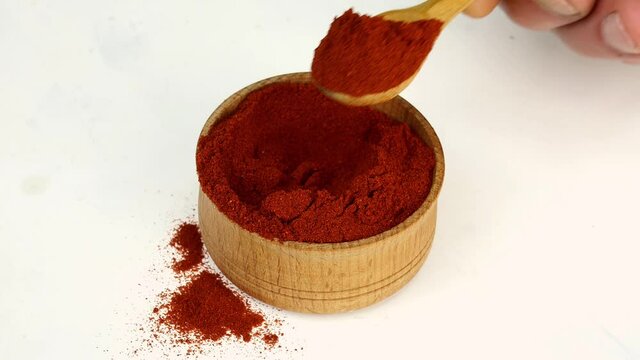 Chef taking spices dry red pepper.