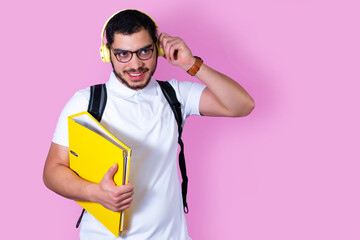 University student with backpack, folder and wireless headphones.