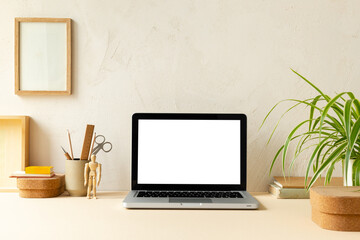 Fototapeta premium Laptop with blank screen on a table. 