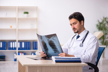 Young male doctor radiologist working in the clinic