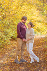 Happy couple in love traveling in autumn adventure outdoor copy space