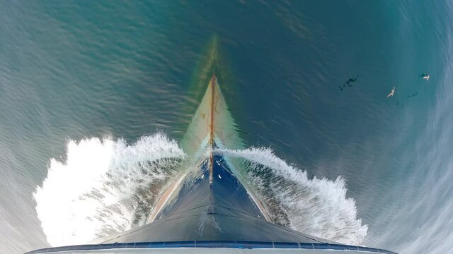 View from above. The bow of the ship is cut by the waves of the calm northern sea.