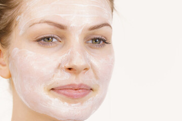 Girl with cream moisture cosmetic on face